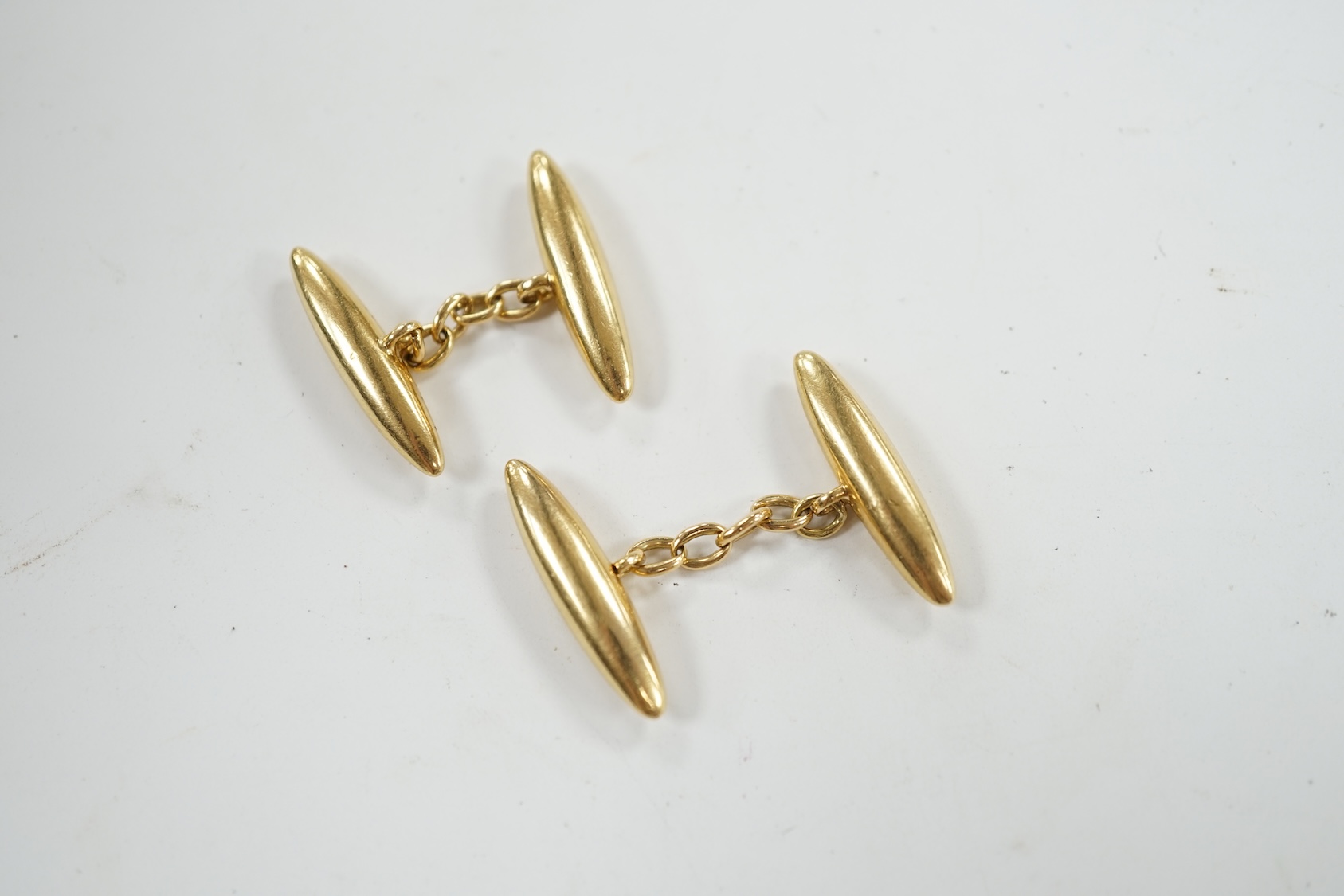 A pair of 18ct torpedo shaped cufflinks, 24mm, 7.9 grams. Condition - poor to fair